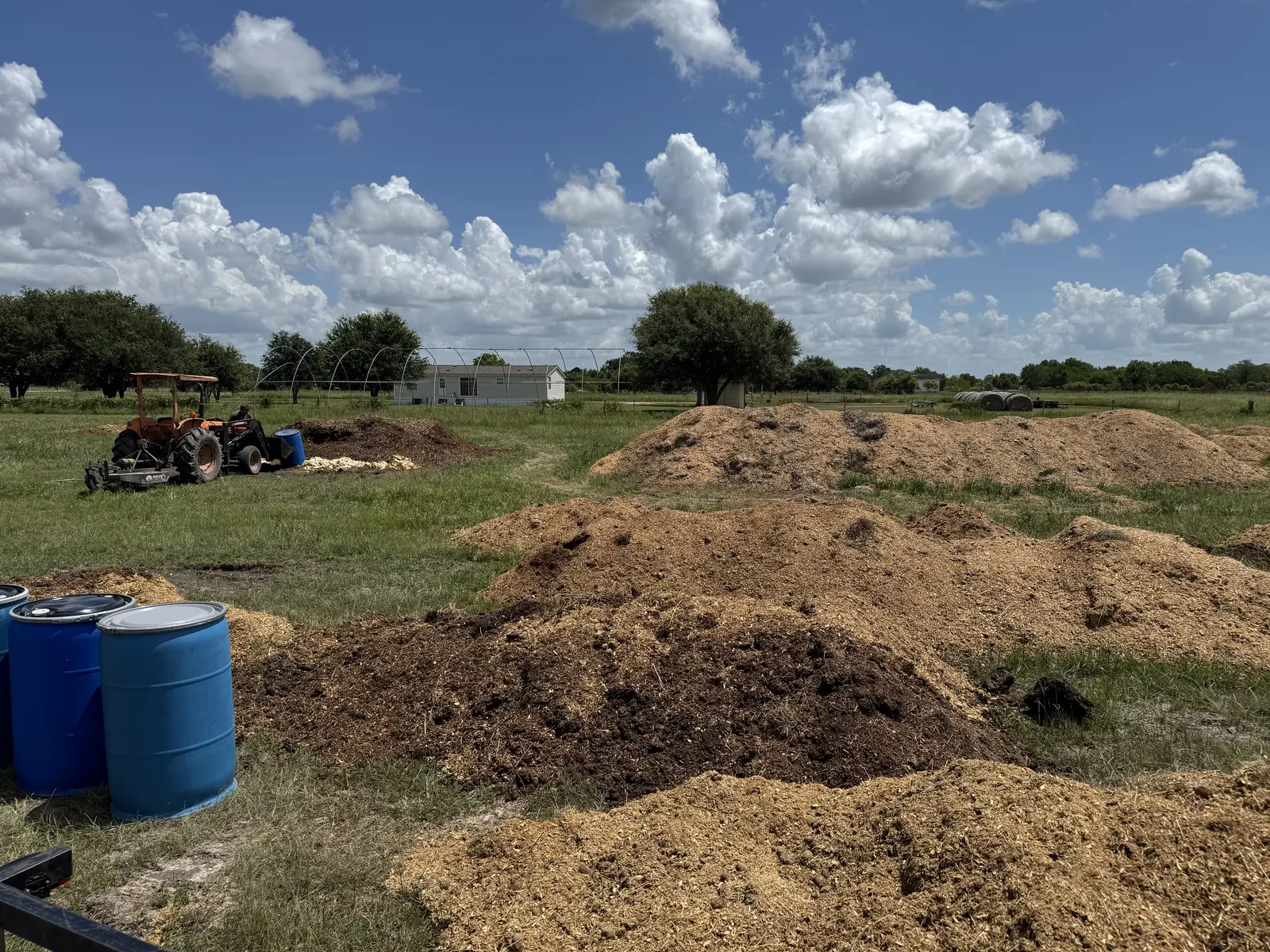 Compost windrows on a local Texas farm served by OnFarmCompost